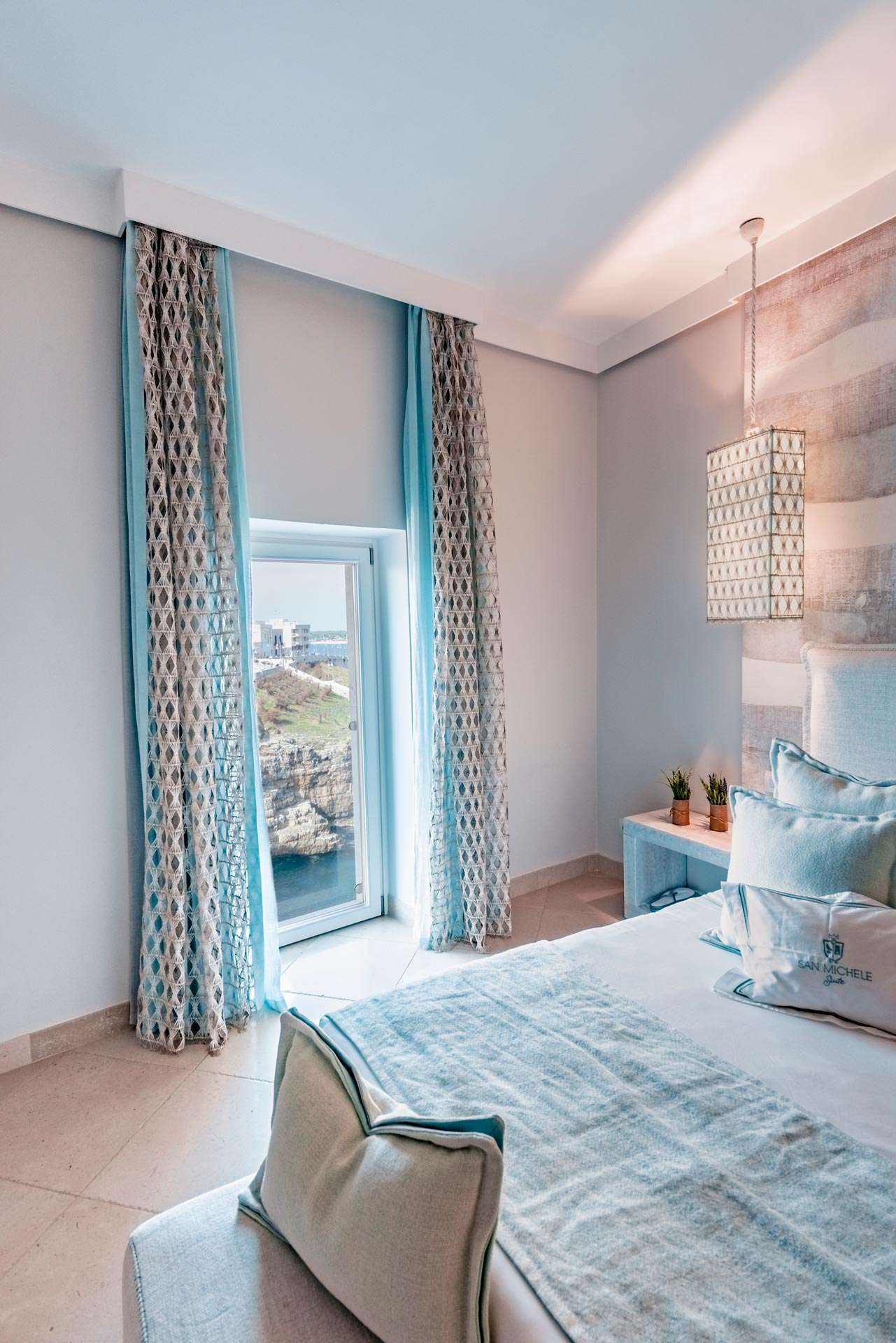 Detail of a bedroom in one of the luxury suites in Polignano a Mare which overlook the sea at San Michele Suite