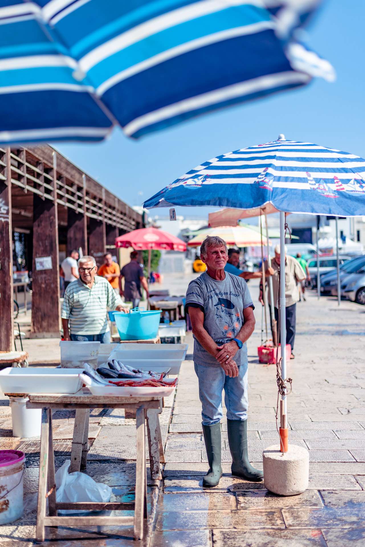 Fisherman at the fish market at the jetty Saint Nicholas in Bari