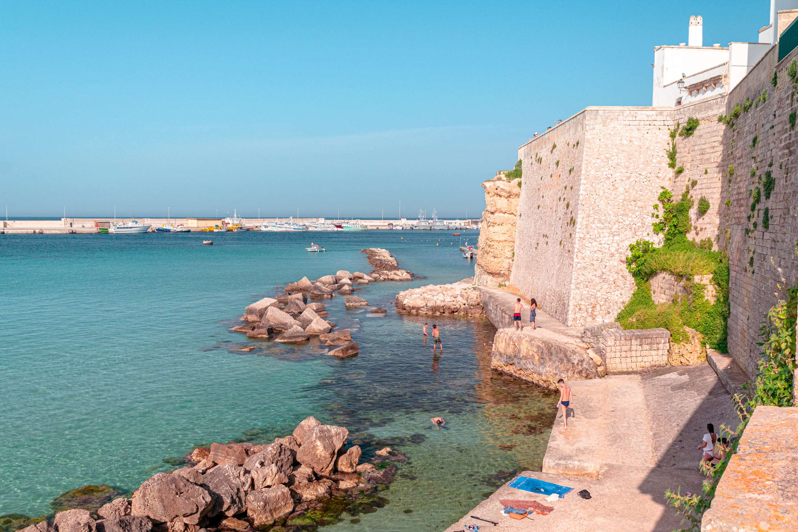 The beautiful sea of Otranto behind the town walls close to the Castle - stop-over of Road Trip in Salento