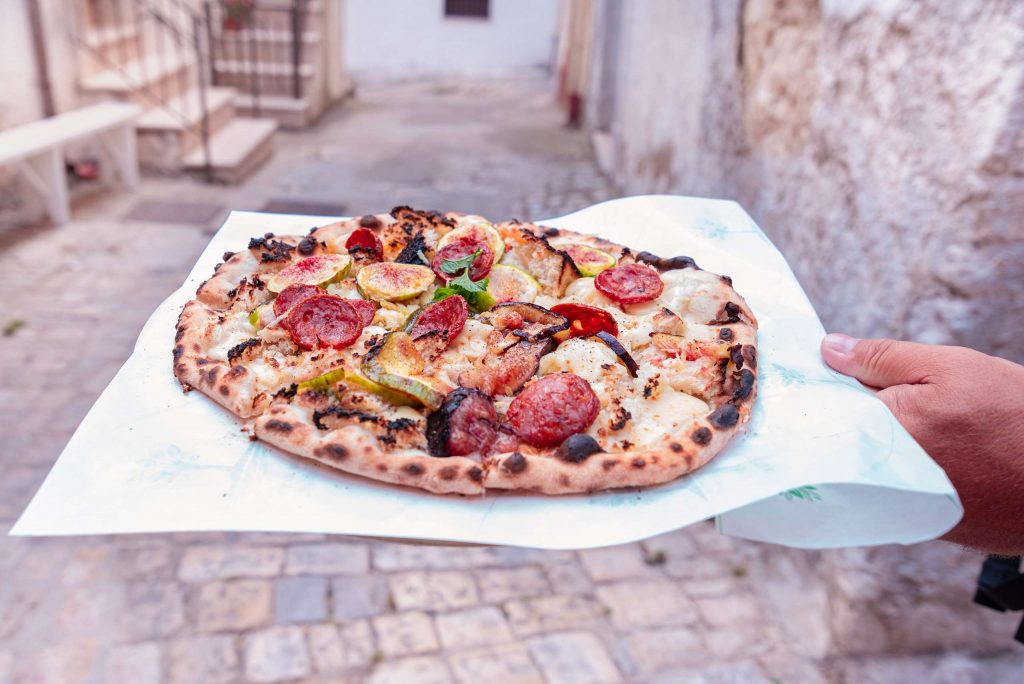 Pizza figs and salami at Pane e salute bakery in Orsara di Puglia